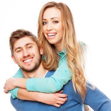 Couple smiling after getting teeth whitened in Armidale